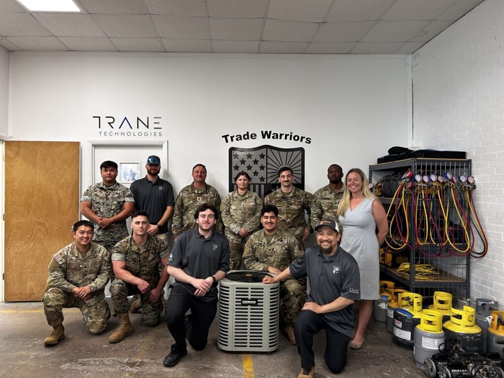 A graduating class of veterans in a free HVAC program